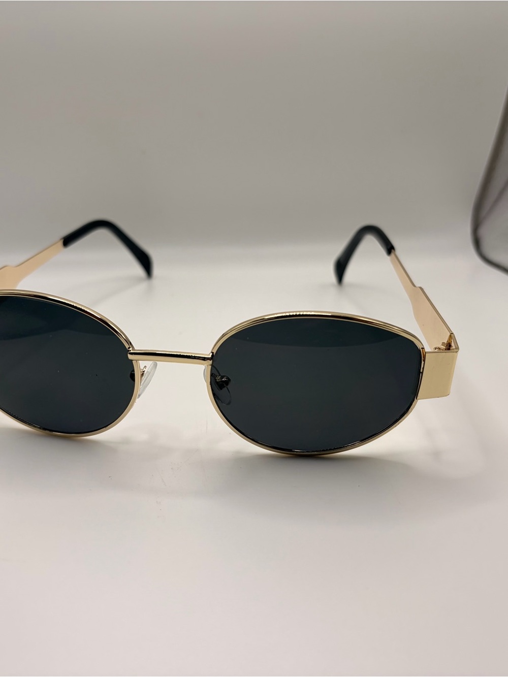Gold Frame Oval Sunglasses with Dark Lenses